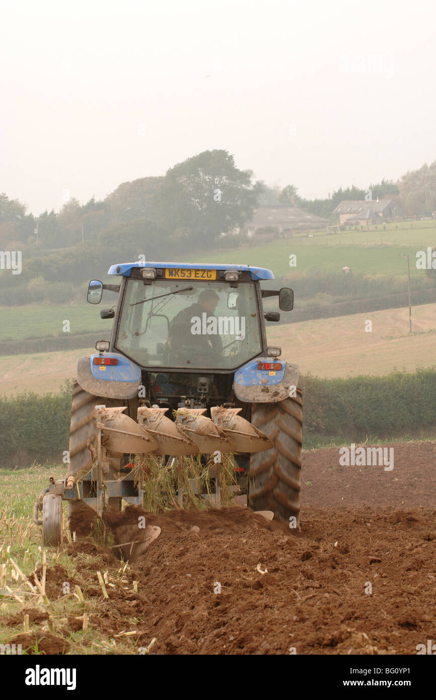 ploughing a field with a ford tractor Stock Photo