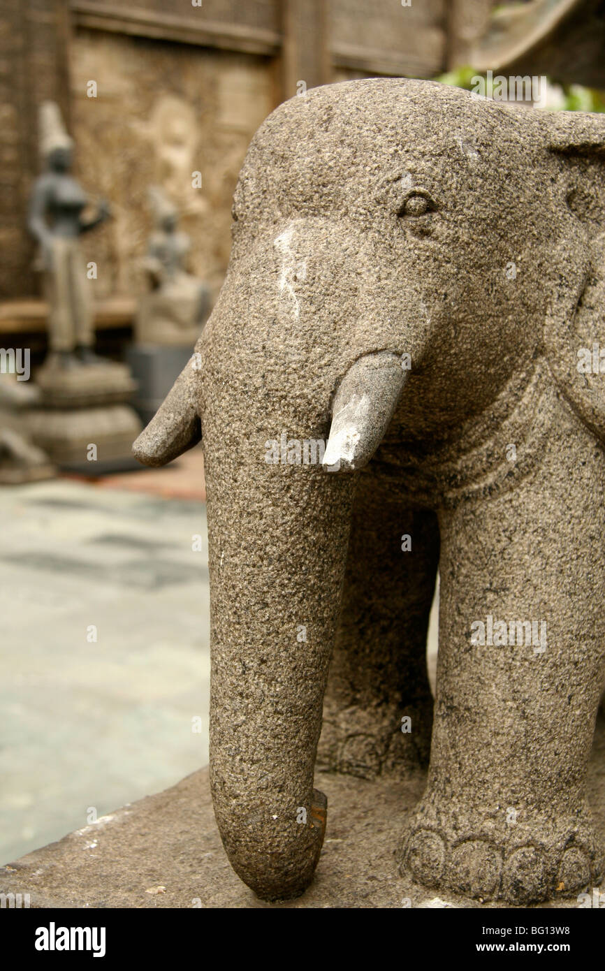 A sculpted statue of an elephant stands guard at the entrance to the Gangaramaya Temple in Colombo, Sri Lanka. Stock Photo