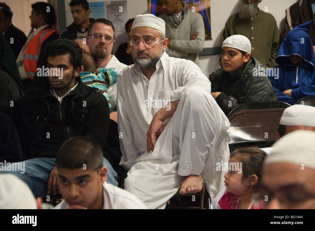 Men in audience at Eid Milad-Un-Nabi Celebrations at Sunni Muslim Association, Tooting, London. Stock Photo
