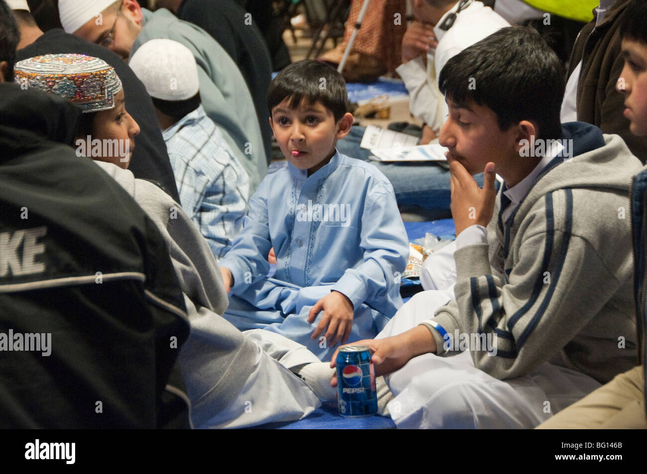 Boys in audience at Eid Milad-Un-Nabi Celebrations at Sunni Muslim Association, Tooting, London. Stock Photo