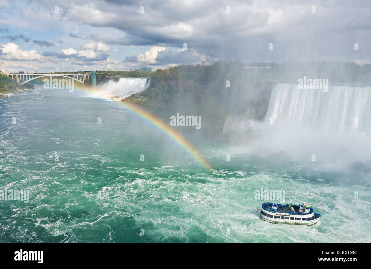 Maid of the Mist tour excursion boat under the Horseshoe Falls waterfall with rainbow at Niagara Falls, Ontario, Canada Stock Photo