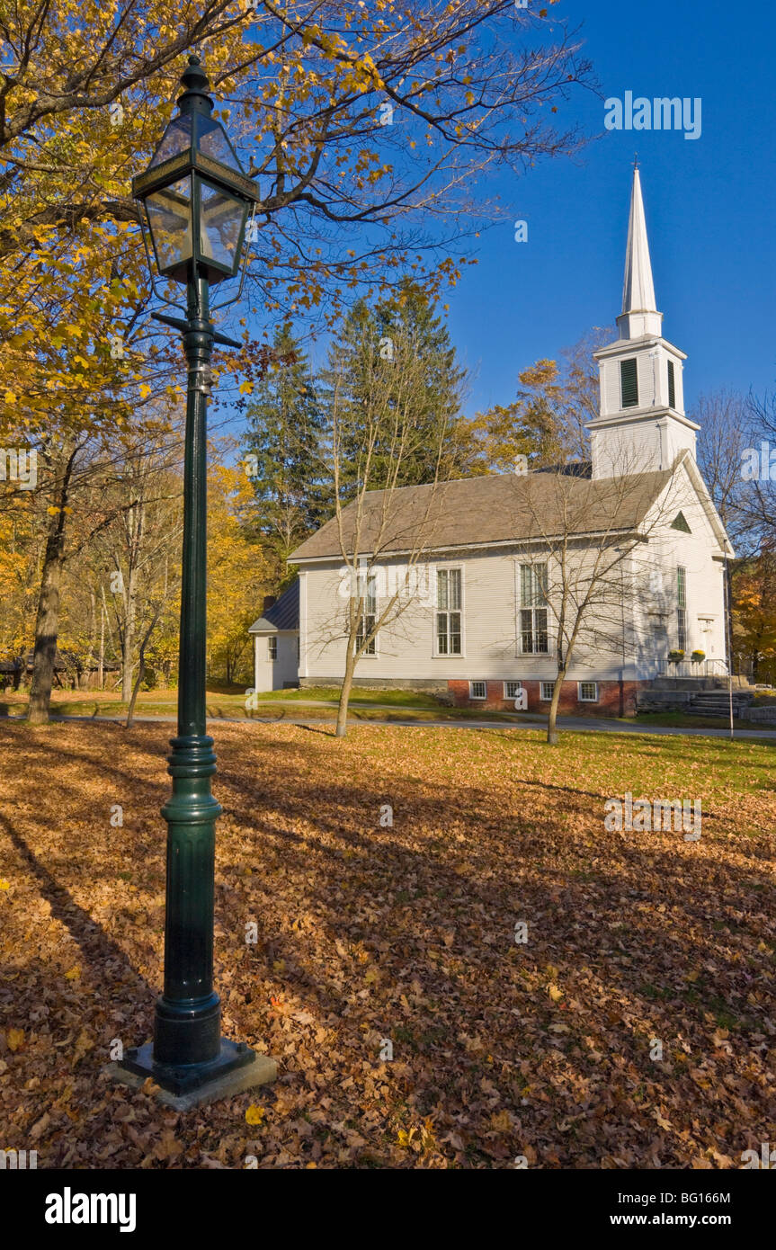 Autumn fall colours around traditional white timber clapperboard church, Grafton, Vermont, New England, USA Stock Photo