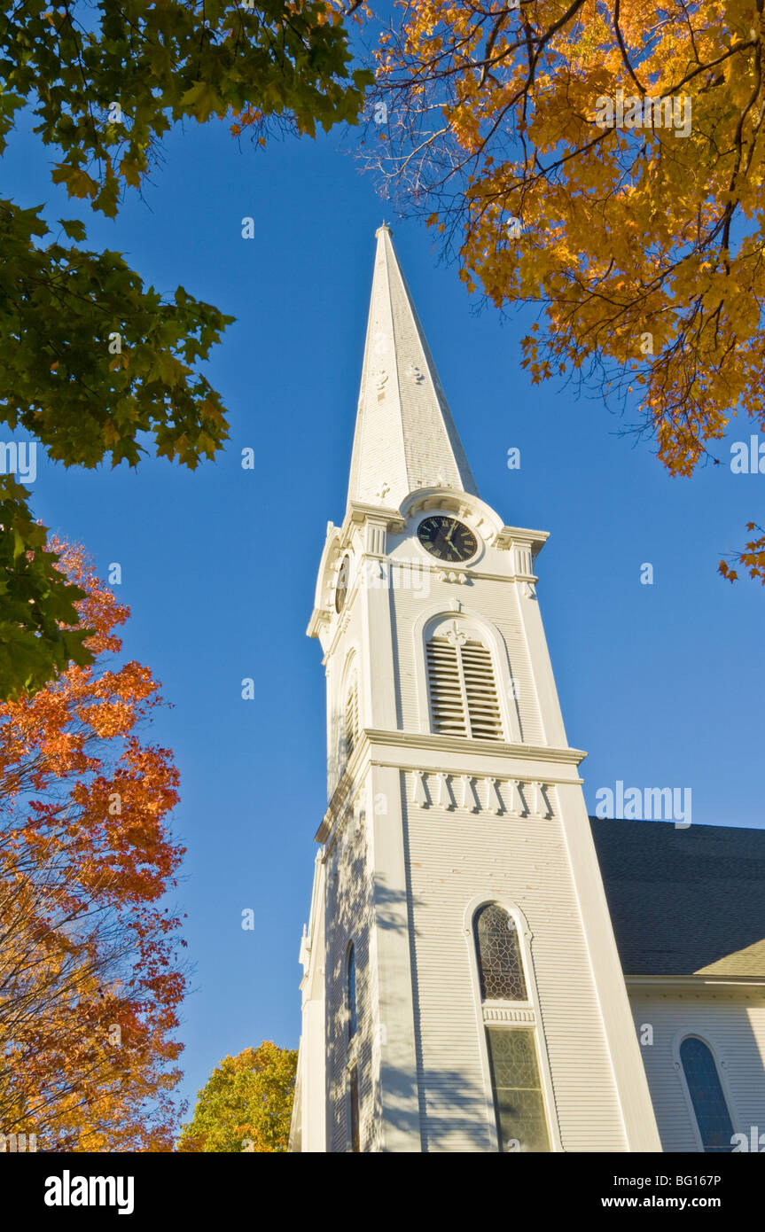 Autumn fall colours around traditional white timber clad church, Manchester, Vermont, New England, United States of America Stock Photo