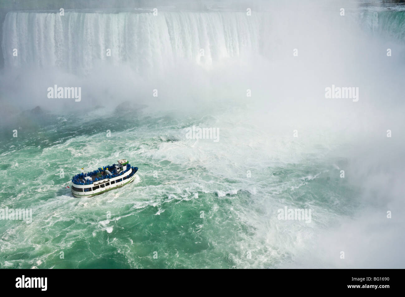 Maid of the Mist tour excursion boat under the Horseshoe Falls waterfall at Niagara Falls, Ontario, Canada, North America Stock Photo