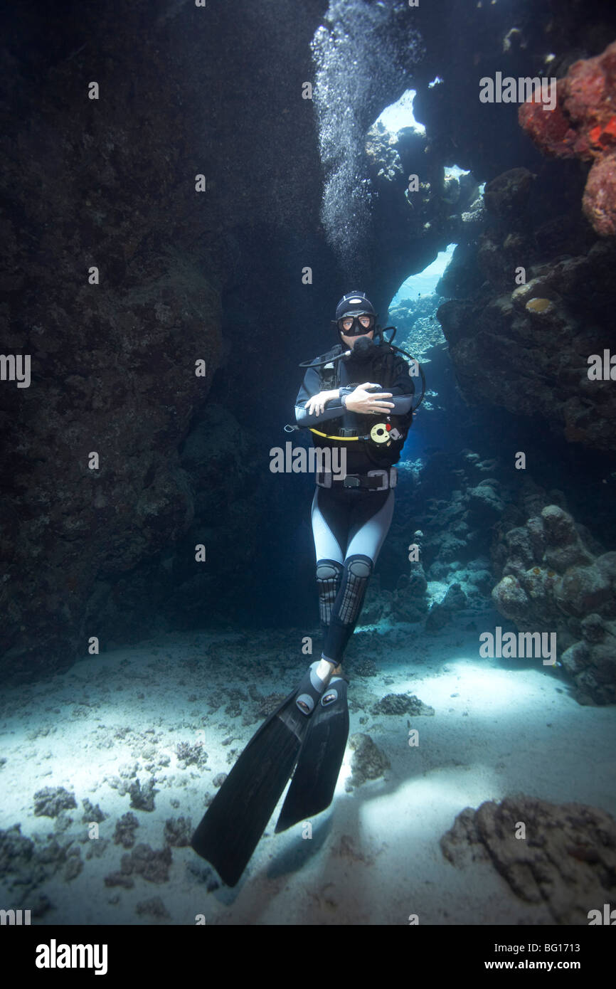 Diver in underwater cave Stock Photo