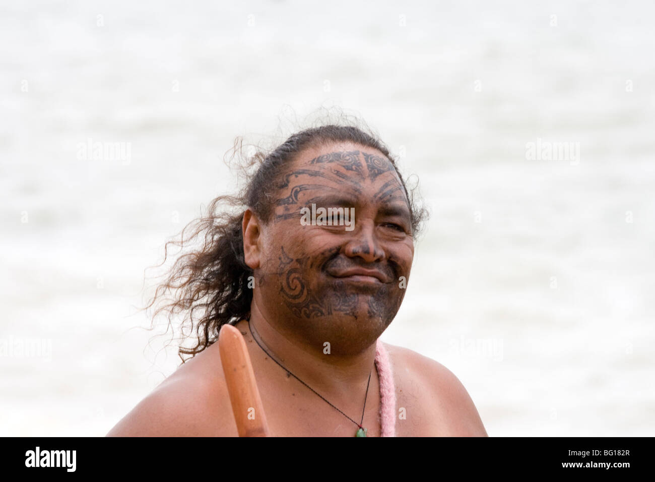 Maori male with painted tribal tattoos on face Stock Photo
