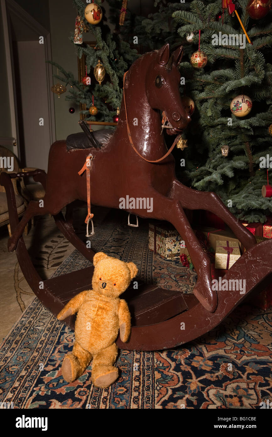 UK, England, Cheshire, Knutsford, Tatton Hall, Christmas tree rocking horse and teddy bear Stock Photo