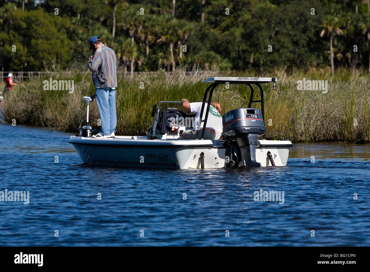 Two men, one a guide fish the Tomoka River Basin in Ormond beach on a cool Sunday afternoon. Stock Photo
