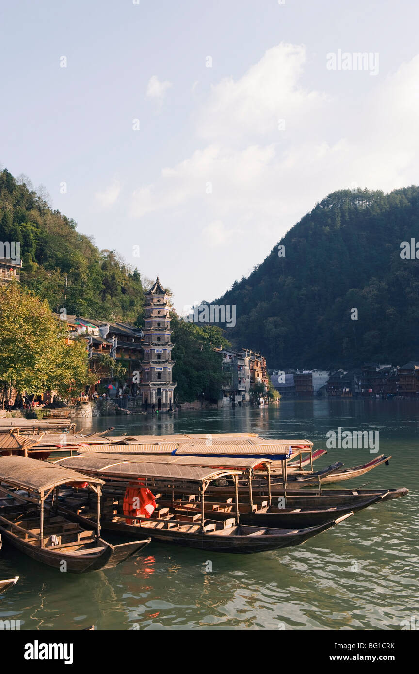 Boats tied up on a river in the old town of Fenghuang, Hunan Province, China, Asia Stock Photo