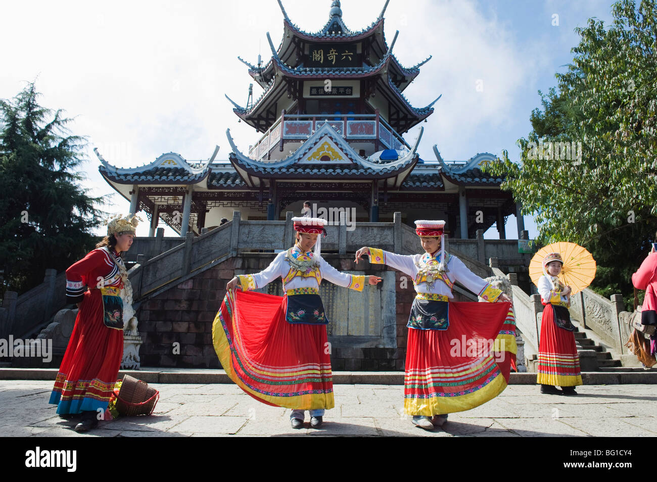 Girls dancing in traditional costume, Zhangjiajie Forest Park, Wulingyuan Scenic Area, Hunan Province, China, Asia Stock Photo