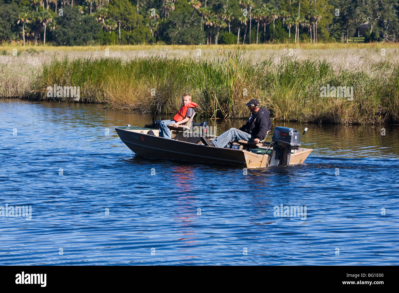 Father and son enjoy a Sunday on the Tomoka Basin fishing in Ormond Beach. Stock Photo