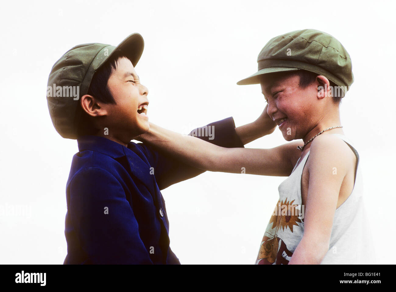 Two young boys at play, Menghun, Yunnan Province, China Stock Photo - Alamy