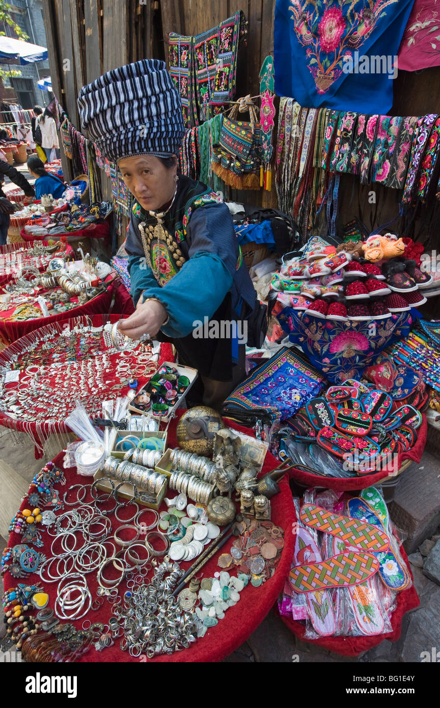 Woman selling ethnic souvenirs at a market in Fenghuang, Hunan Province, China, Asia Stock Photo