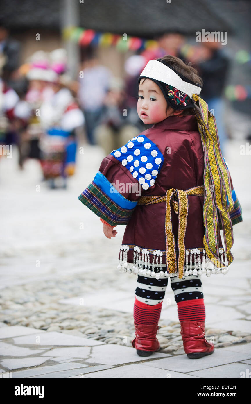 A girl in ethnic costume at a Lunar New Year festival in the Miao village of Qingman, Guizhou Province, China, Asia Stock Photo