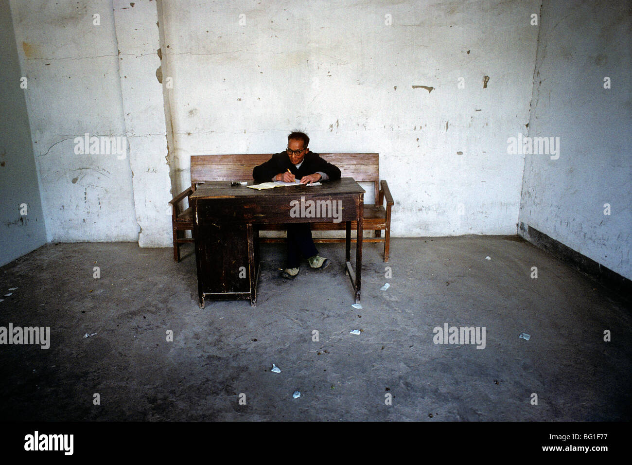 A bus dispatcher in his office in Yangshuo, China Stock Photo - Alamy