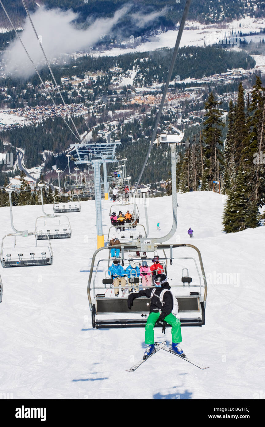 Chairlift with skiers, Whistler mountain resort, venue of the 2010 Winter Olympic Games, British Columbia, Canada, North America Stock Photo