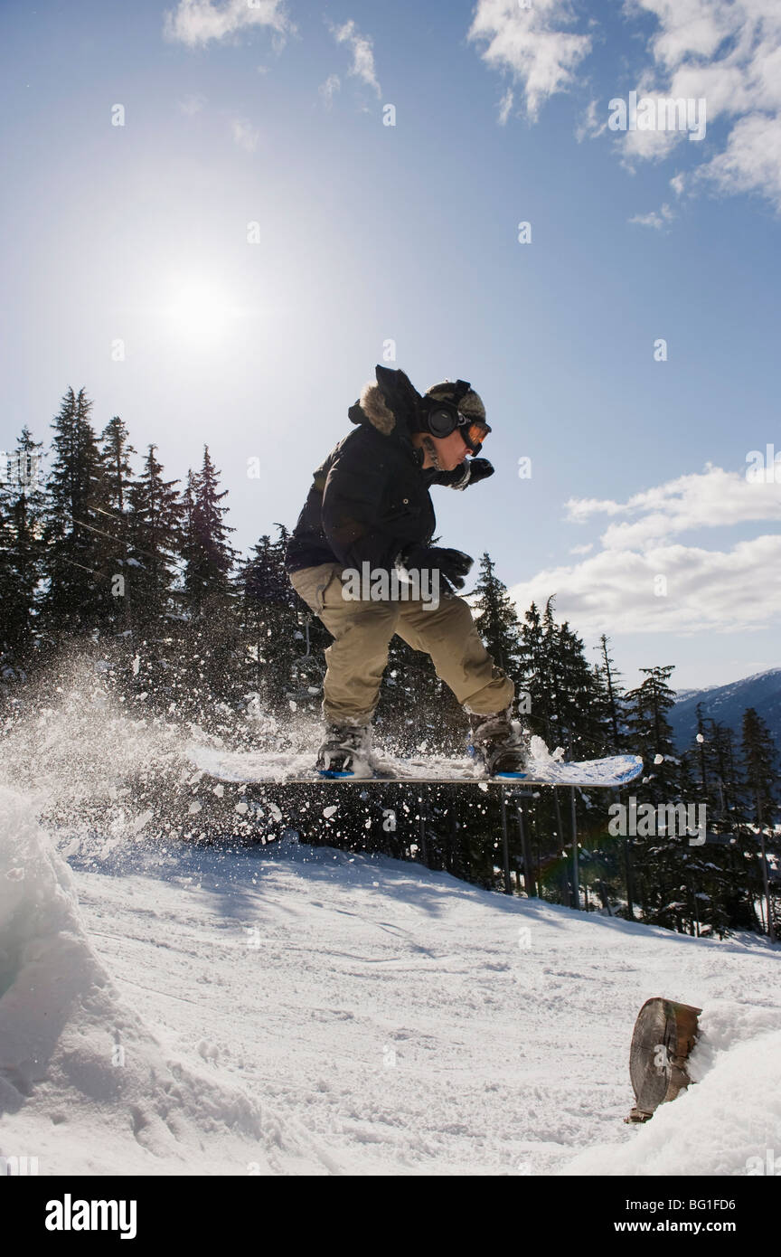 A snowboarder jumping at Whistler mountain resort, venue of the 2010 Winter Olympic Games, British Columbia, Canada Stock Photo