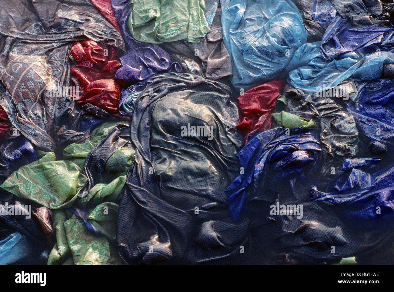 Garments being washed in the Ganges River, Varanasi, India Stock Photo
