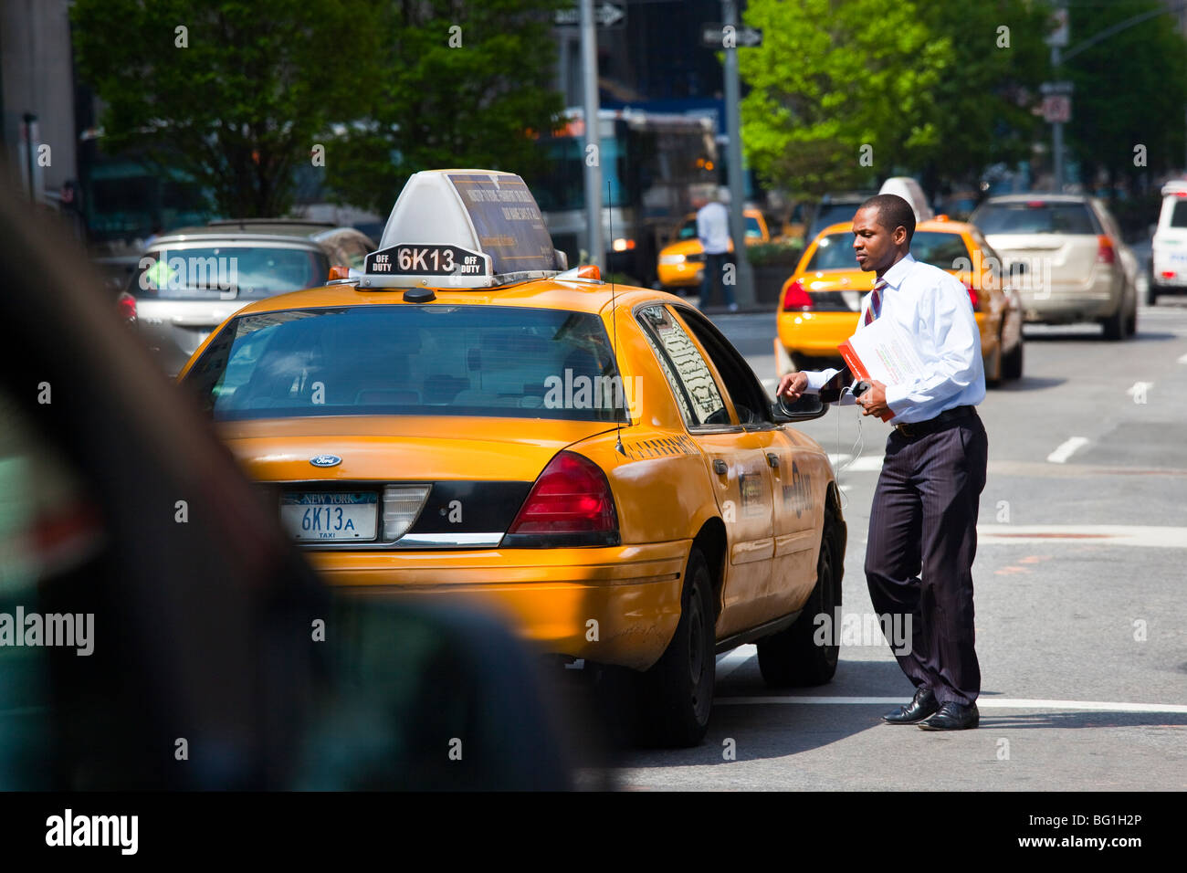 Hailing a Taxicab in Manhattan, New York City Stock Photo