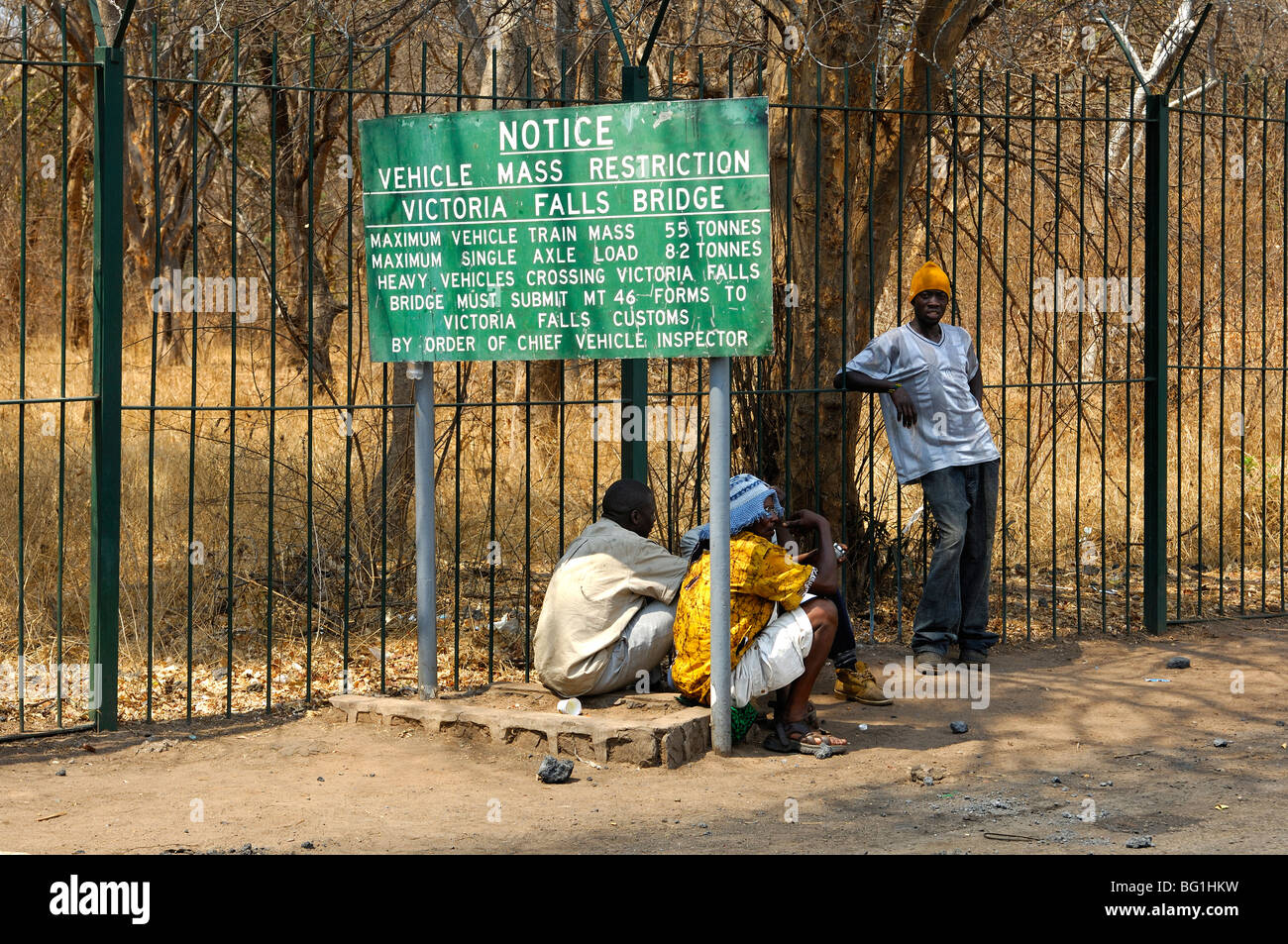 Information board indicating vehicle mass restriction regulations for crossing the Victoria Falls bridge,Victoria Falls, Zimbabe Stock Photo