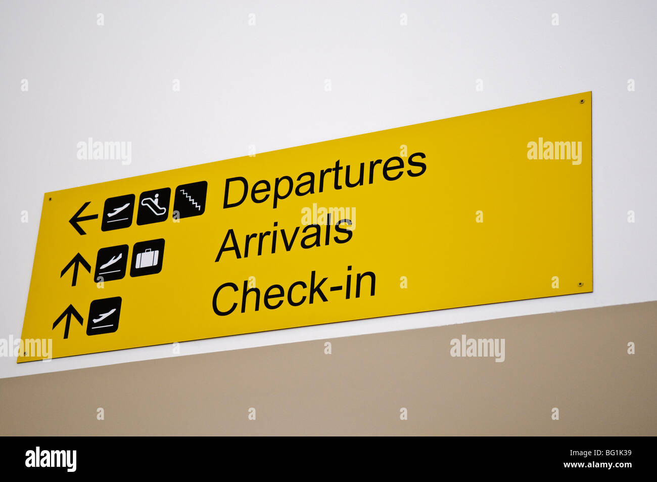 Sign in an airport with directions to departures, arrivals and check-in Stock Photo