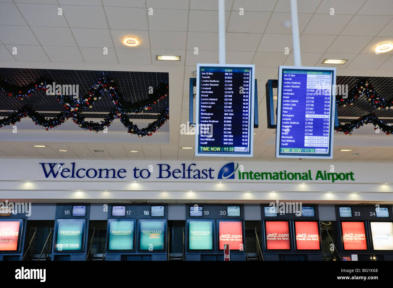 Checkin desks at Belfast International Airport, Northern Ireland. Stock Photo