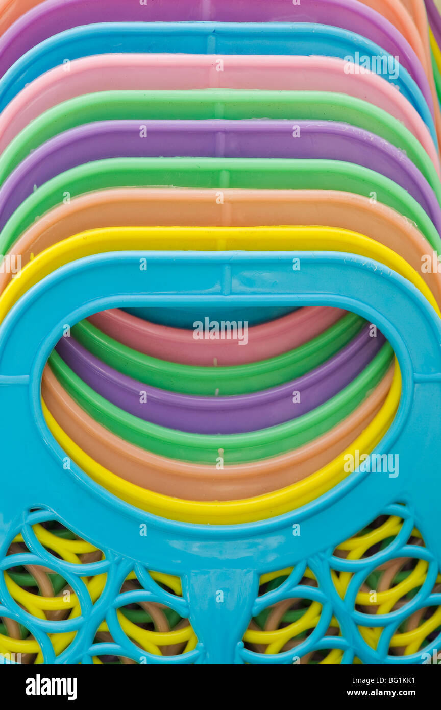 Colourful plastic indian shopping basket handles abstract. Andhra Pradesh, India Stock Photo