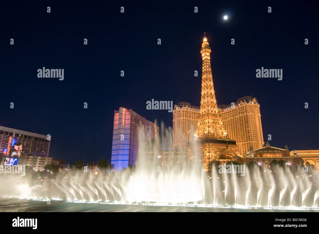 Fountains of Bellagio, Bellagio Hotel, Eiffel Tower of Paris Las Vegas in bg, The Strip, Las Vegas, Nevada, USA Stock Photo