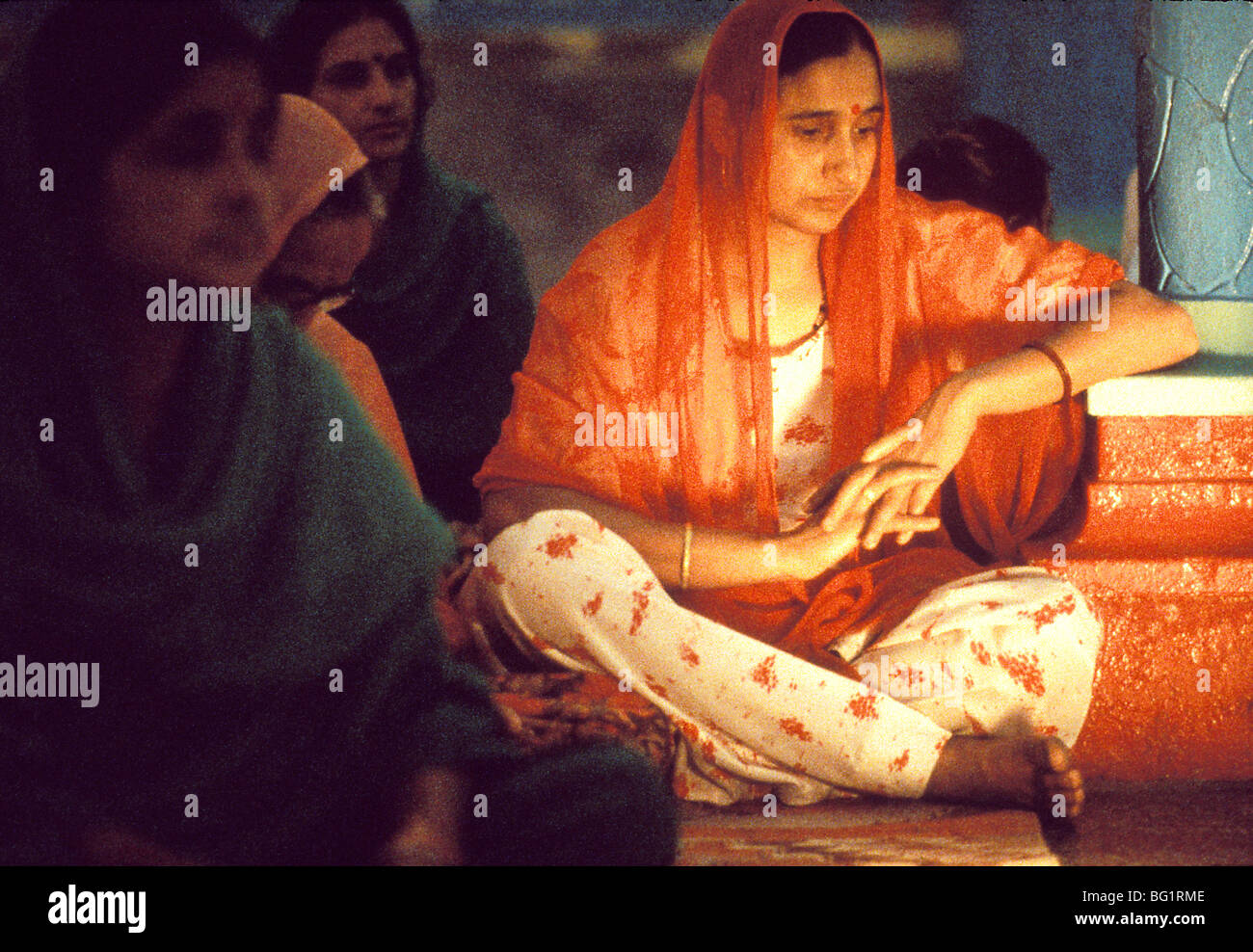 Hindu women worship and pray in a small temple in Palampur, India Stock Photo