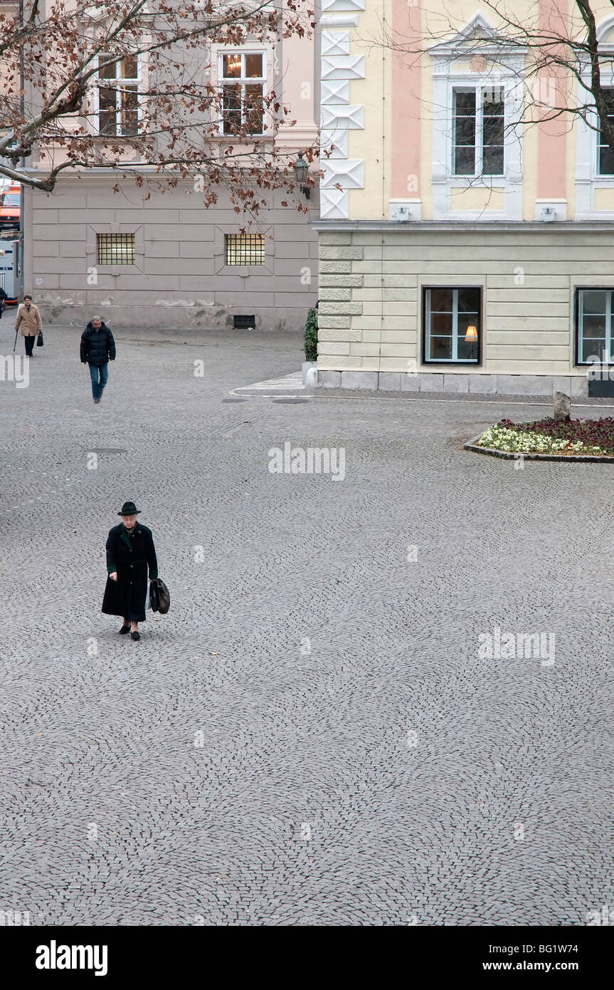 people walk on a square in the Klagenfurt center Stock Photo
