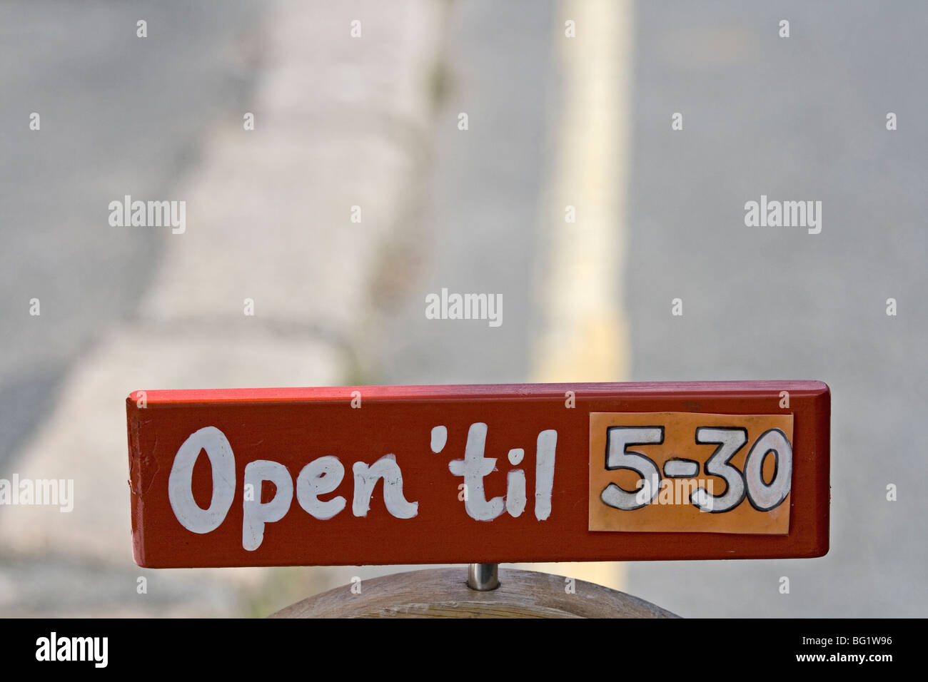 Opening hours for Archie's Loft. Shop sign, Coverack, Cornwall Stock