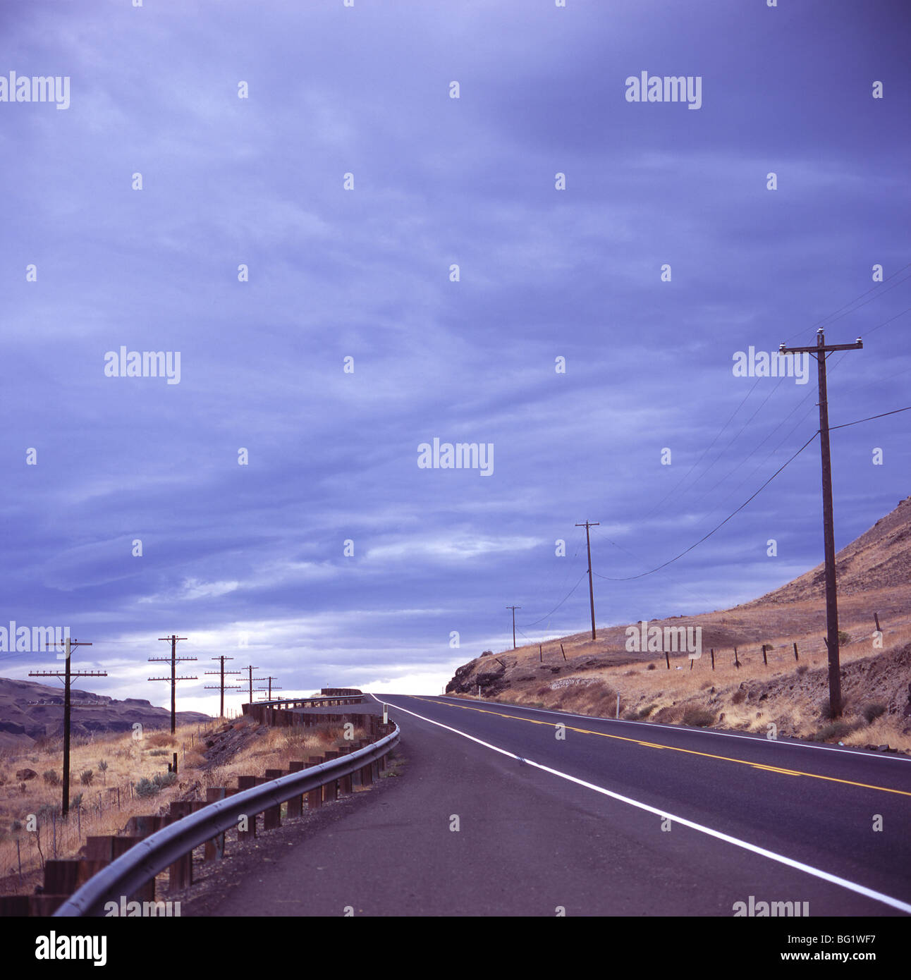 Empty road with power poles on both sides, Eastern Washington State, United States of America, North America Stock Photo