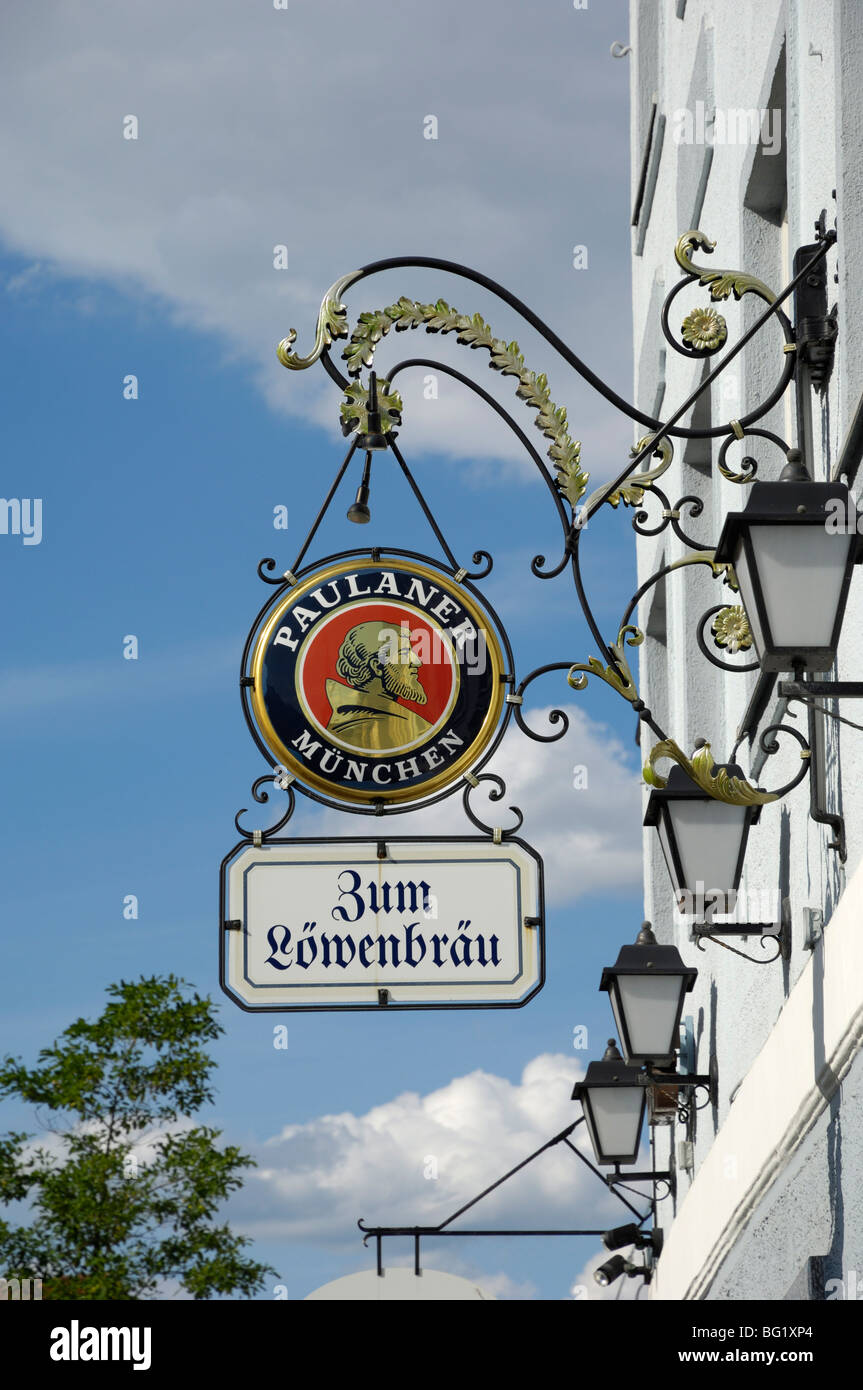 Wrought iron sign advertising Paulaner and Lowenbrau beer, Wolfrathausen, near Munich, Bavaria, Germany, Europe Stock Photo