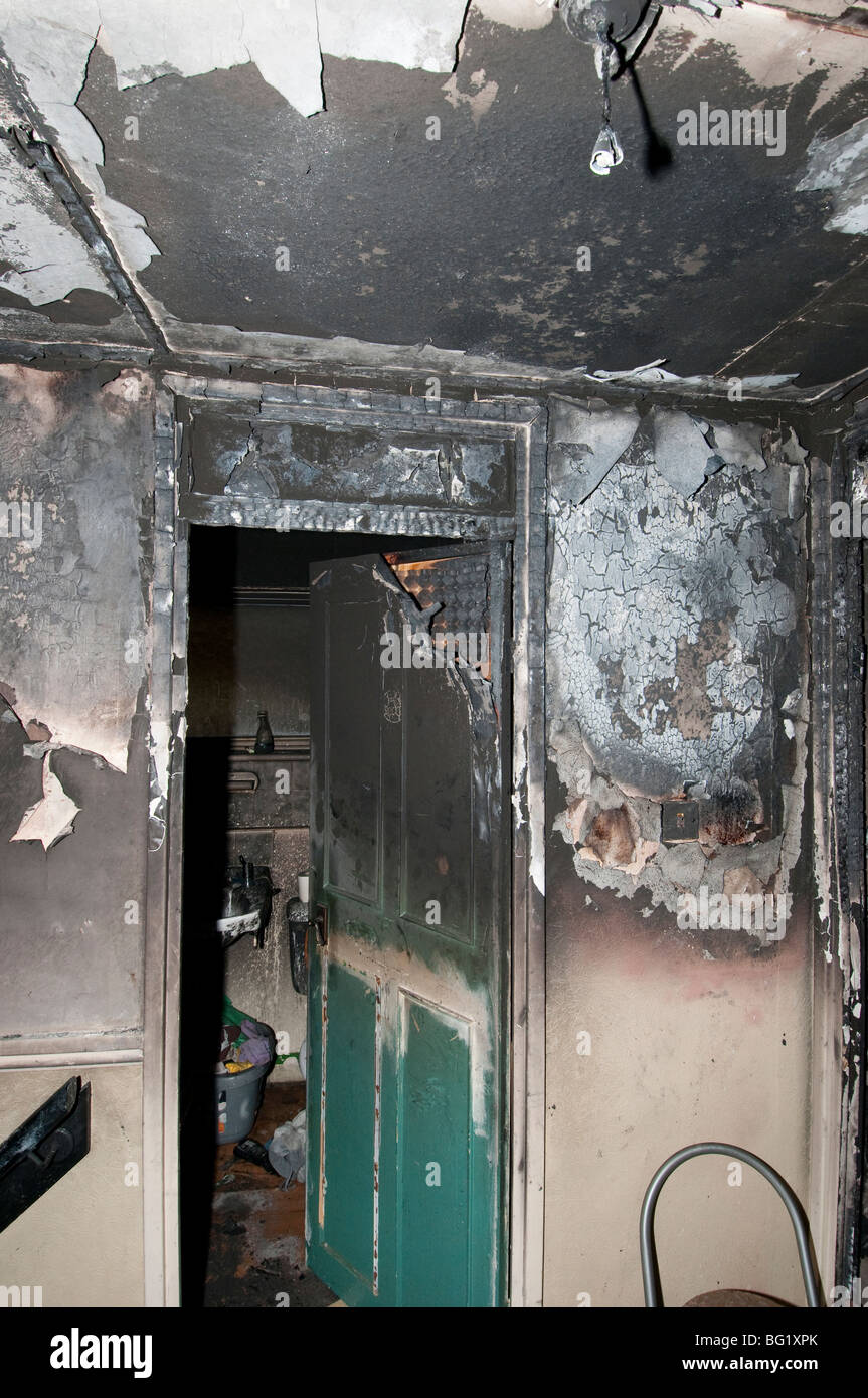 Bathroom door showing house fire damage Stock Photo