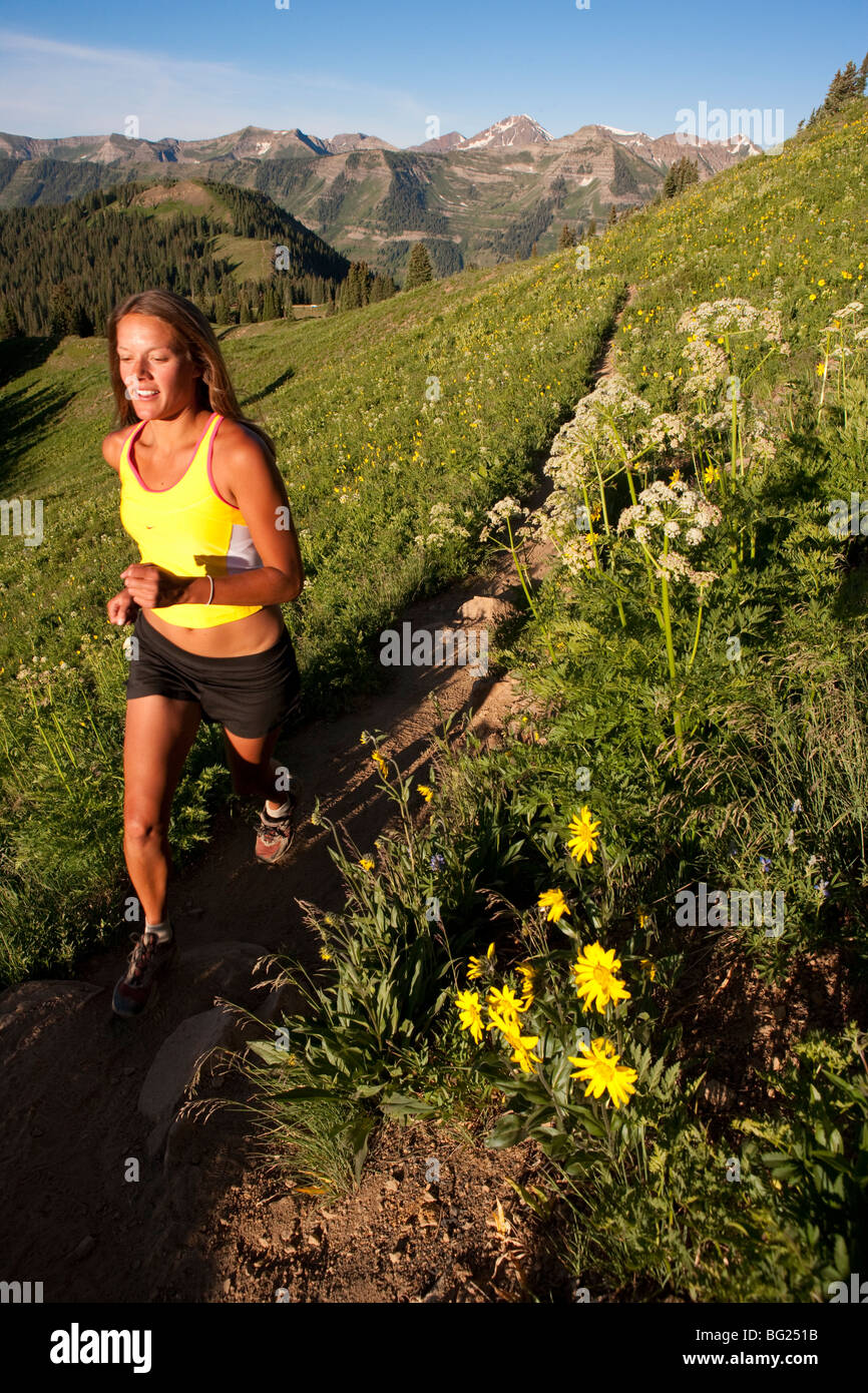 Woman trail running, Trail 403, Gunnison National Forest, near Crested ...