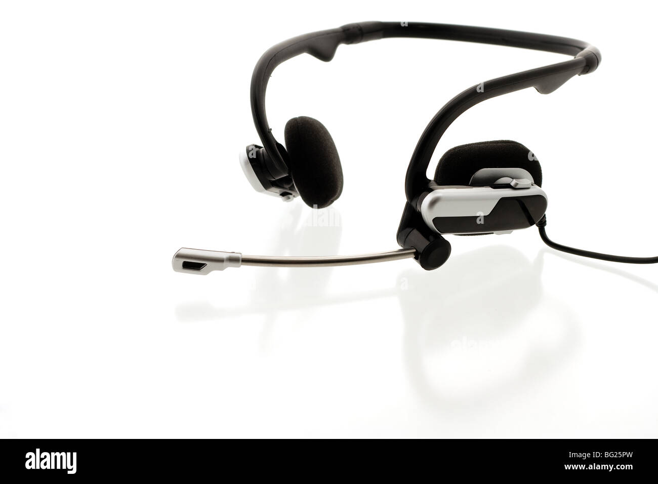 Headset on reflecting white background Stock Photo - Alamy