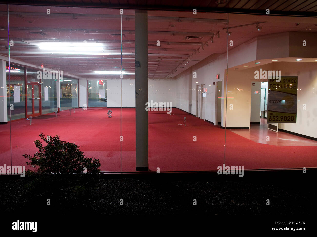 A vacant retail store front in a shopping center.  Stock Photo