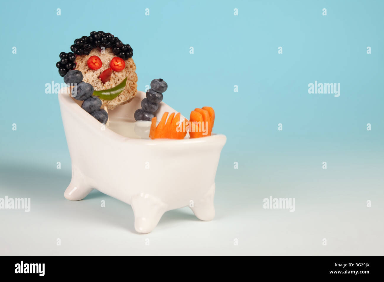Funny food face in a bathtub full of milk Stock Photo Alamy