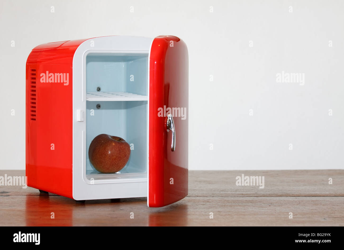 Shiny bright red miniature fridge Stock Photo Alamy