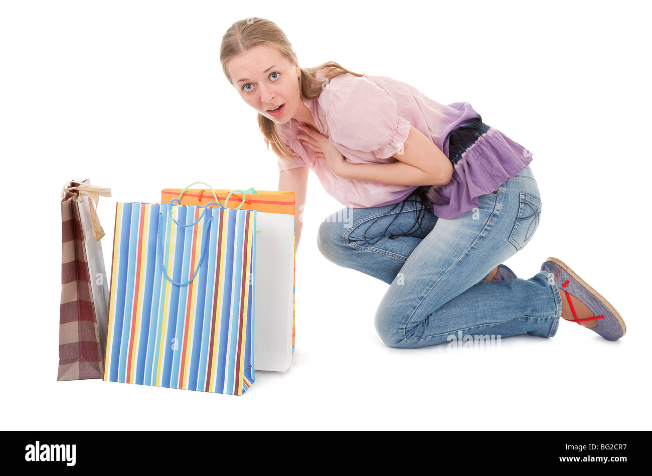 young girl with purchases on white background Stock Photo