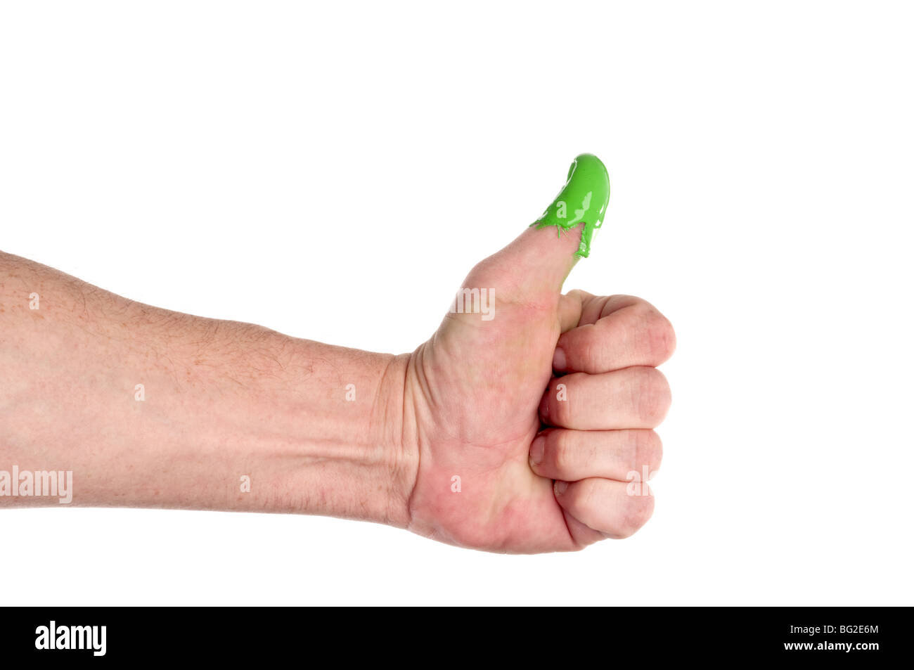 A man with a green thumb on white Stock Photo