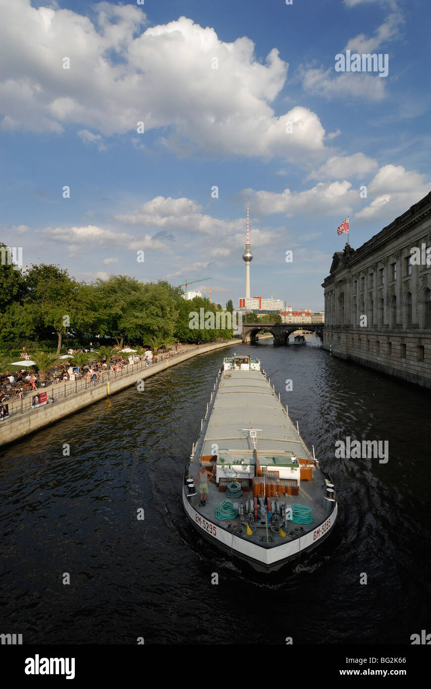Berlin. Germany. Commercial cargo barge navigates the River Spree in the heart of Mitte. Stock Photo