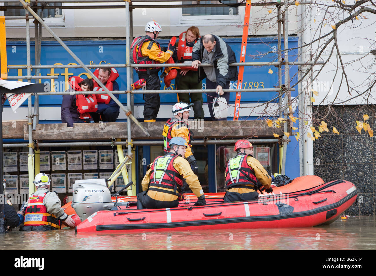 RNLI and mountain rescue teams evacuate residents from Cockermouths main street during the devastating November 2009 floods. Stock Photo