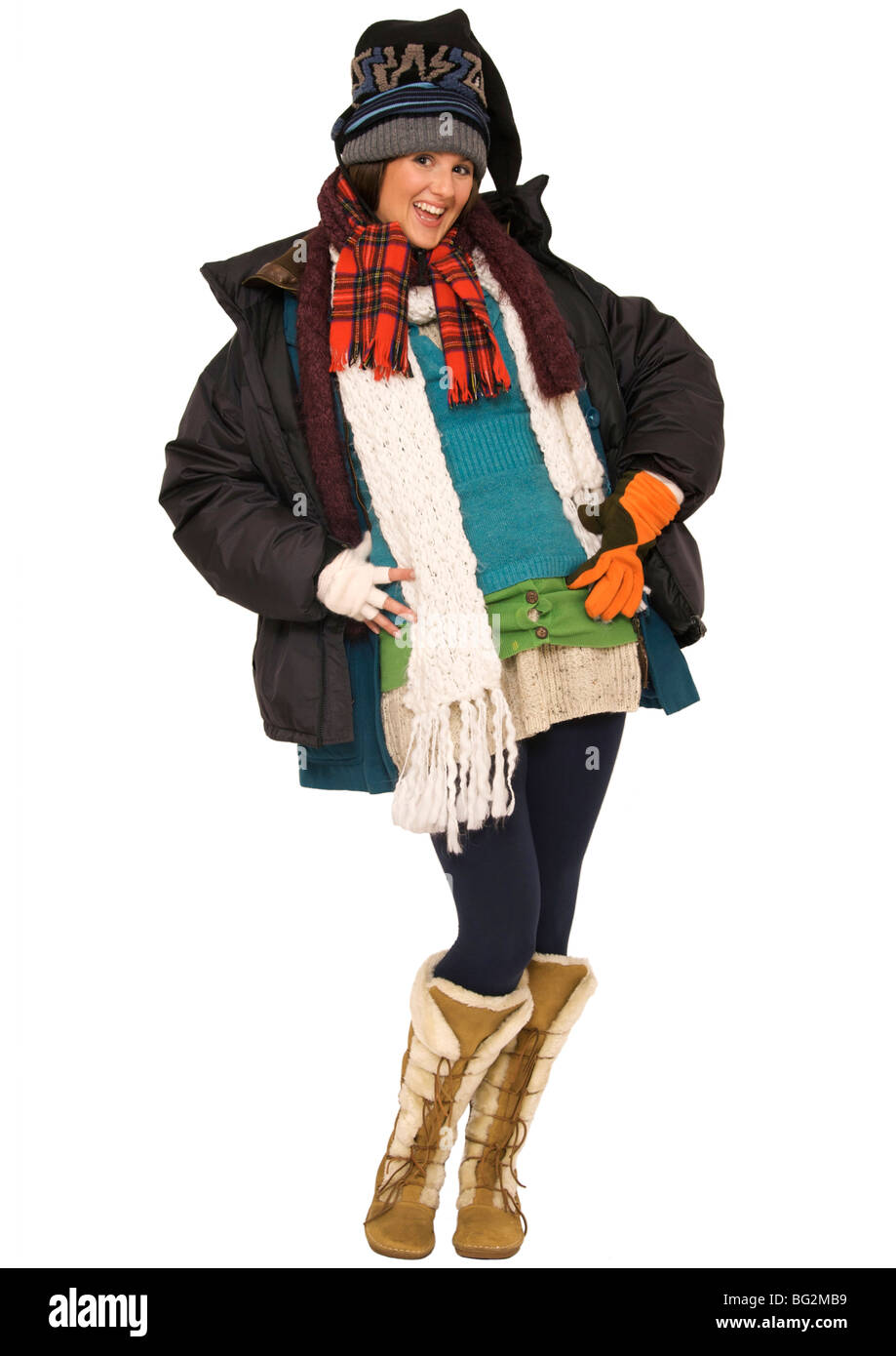 Happy young woman wearing multi-layers of clothing to keep warm Stock Photo