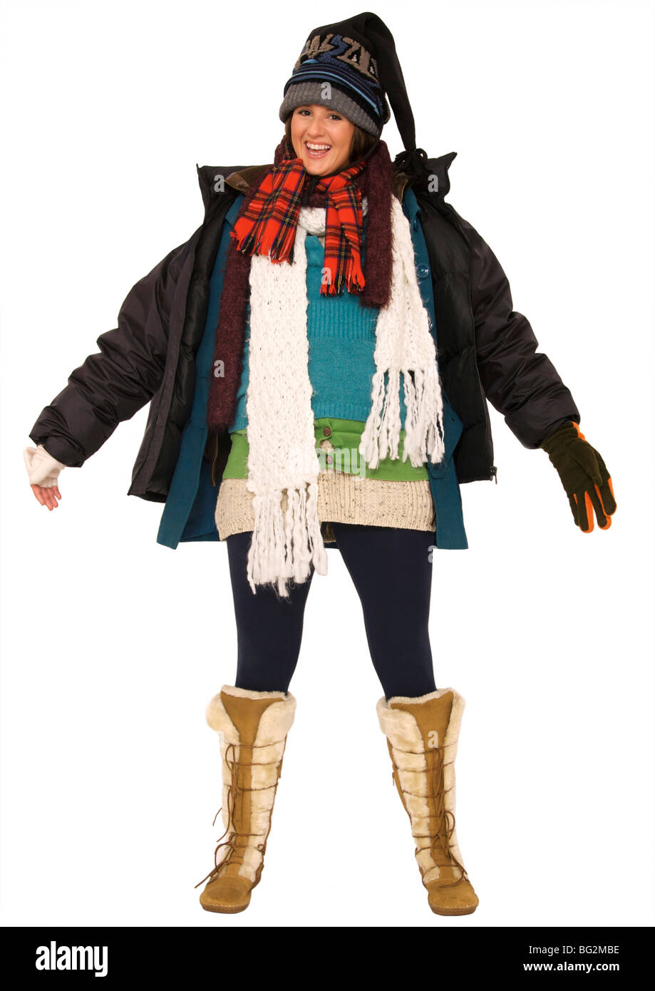 Happy young woman wearing multi-layers of clothing to keep warm Stock Photo  - Alamy