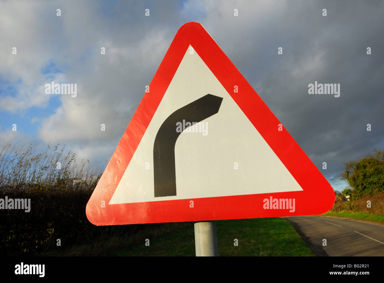 Uk Road Sign .Warning right hand bend ahead. Stock Photo