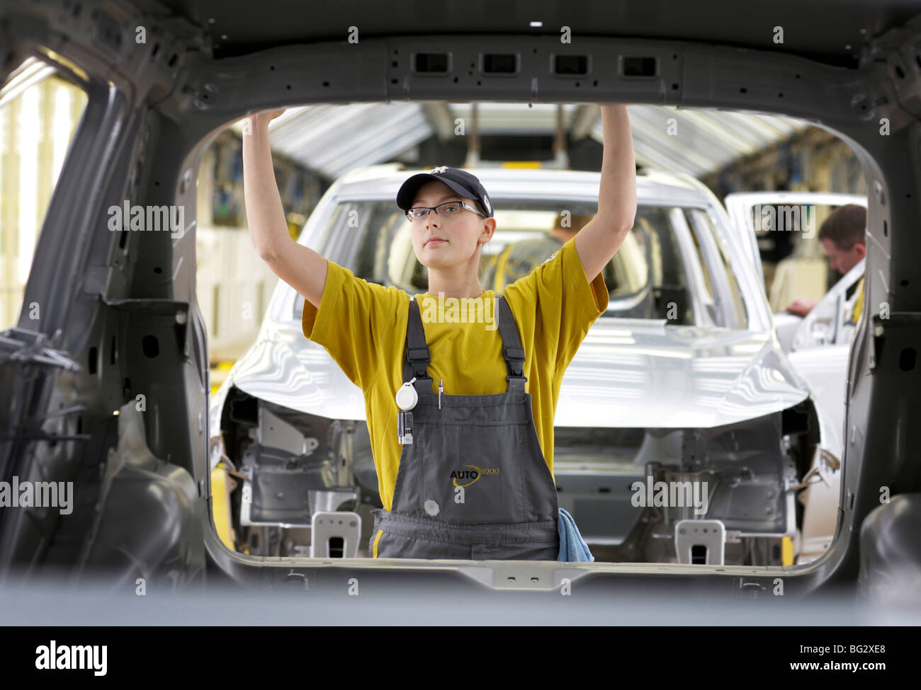 Female worker at finishing of Tiguan and Touran at Auto 5000 Gmbh Stock Photo