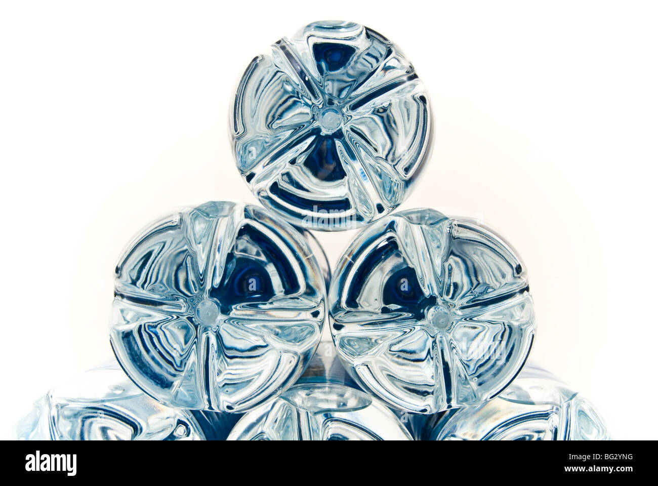 Moulded plastic bottle bottoms with a blue reflection from labels in a