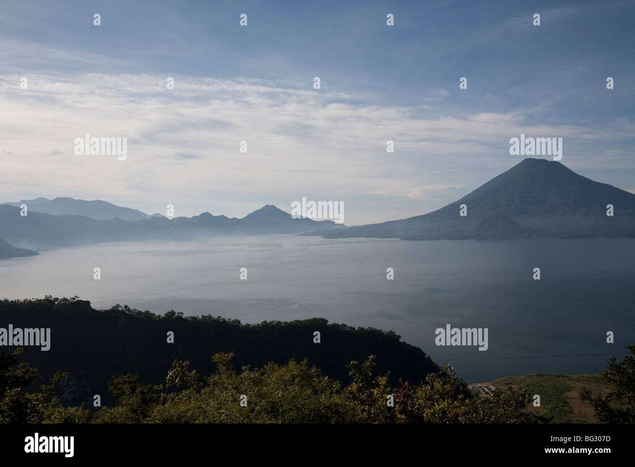 Volcanos San Pedro, Toliman and Atitlan at Lake Atitlan Guatemala. Stock Photo