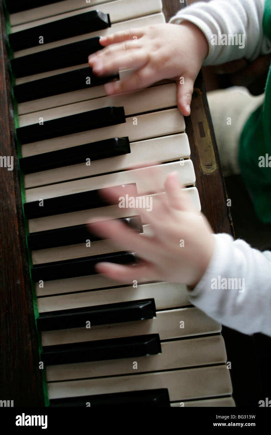 Little child playing piano . Bonn , Germany . Stock Photo